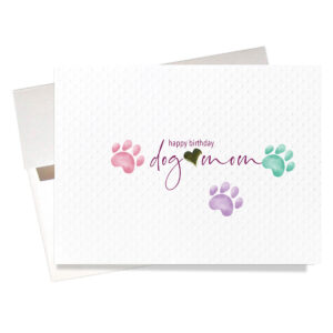 "Happy birthday dog mom" card is perfect for just the right dog lover. Attractive raised gold heart, colorful paw prints and textured card stock. Comes with an elegant iridescent envelope.